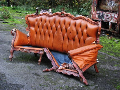 Front of a skip and collection vehicle at a yard entrance