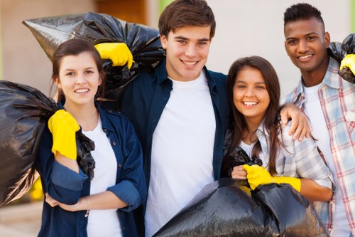 Business professionals managing waste with a commercial skip