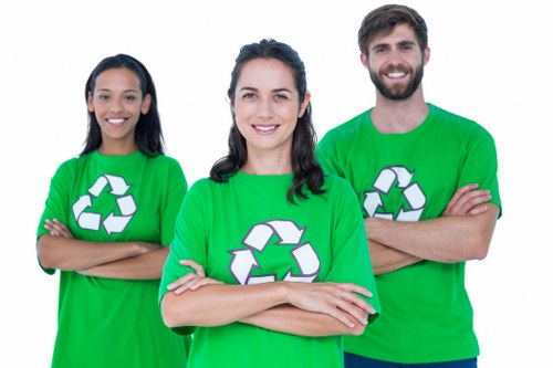 Professional loading construction waste into a skip